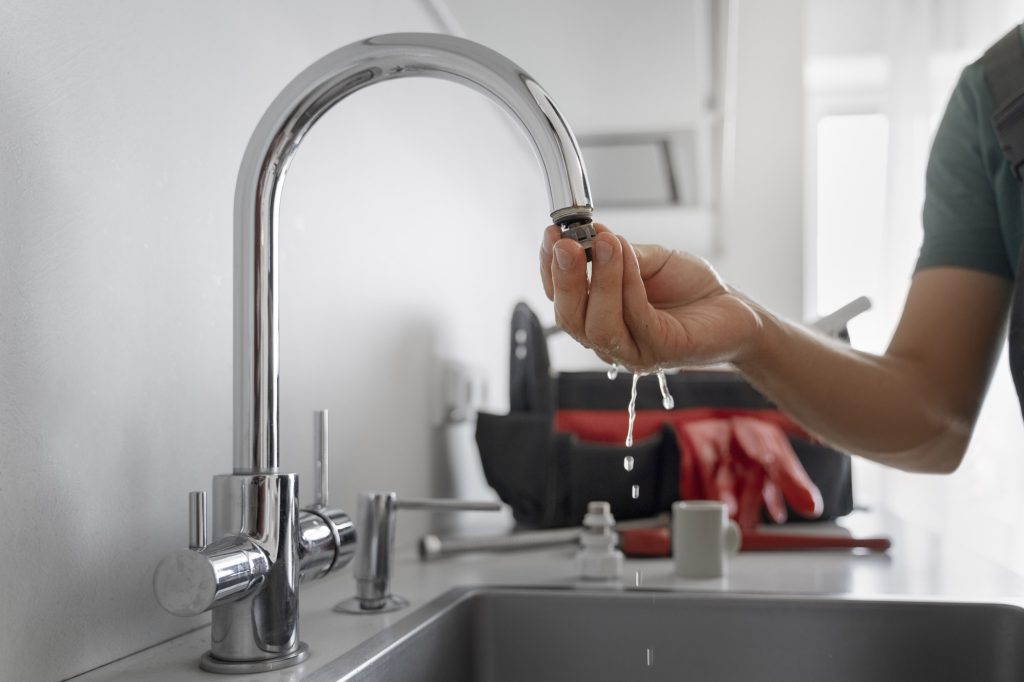 Water running from a kitchen faucet